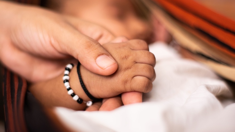 A newborn baby holding