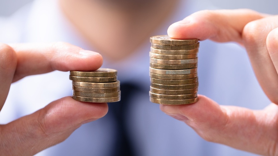 Man Holding Two Coin