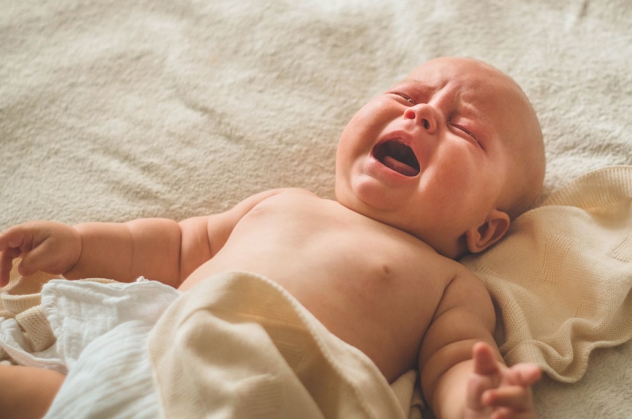 Crying hungry newborn baby