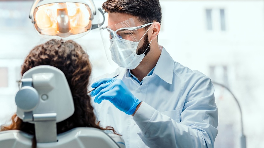 Dentist working in dental