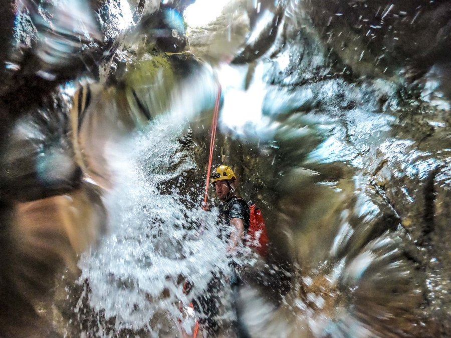 A canyoning adventurer visible