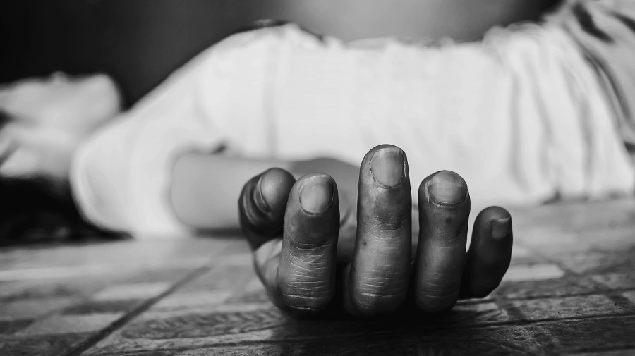 woman unconscious falling on ground on black background in white tone with shadow edge