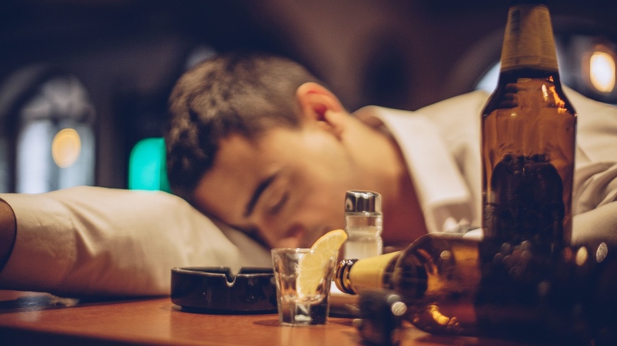 Young drunk man sleeping