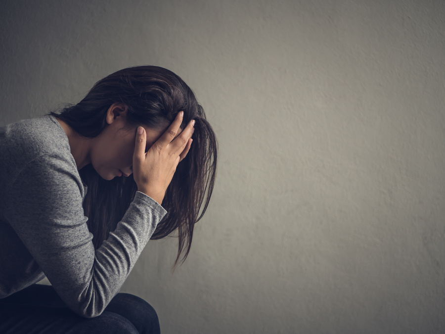 Depressed woman sitting on