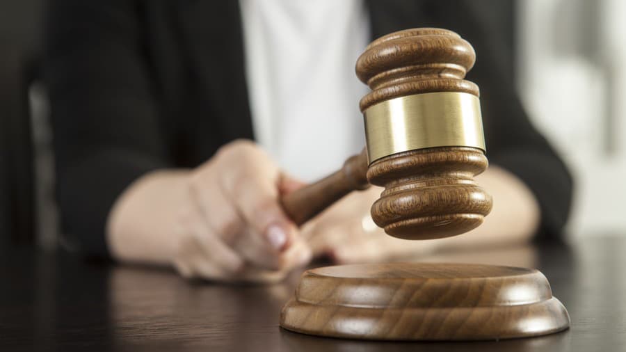 Caucasian woman holding gavel