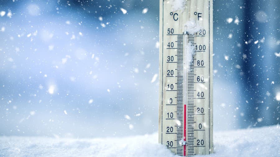 Thermometer on snow shows