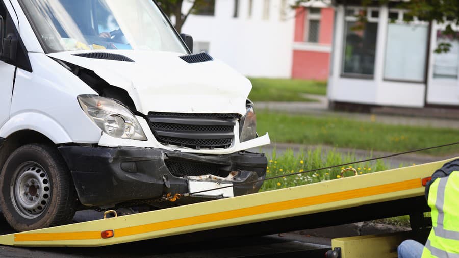 Wrecked white car pulling