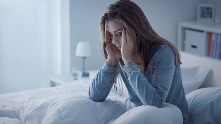 Depressed woman awake in