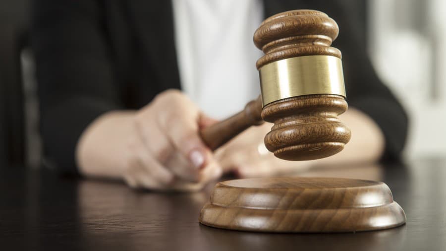 Caucasian woman holding gavel