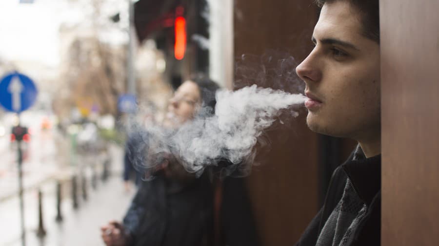 Young man smoking a