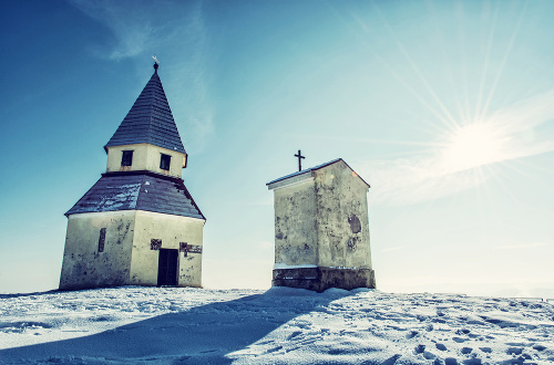 Calvary in Nitra, Slovak republic. Winter snowy scenery. Religious architecture. Blue photo filter.