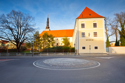 Trnava, Slovakia - March 31, 2016: Western Slovak Museum in Trnava in western Slovakia. Tower of a church can be seen behind the building.