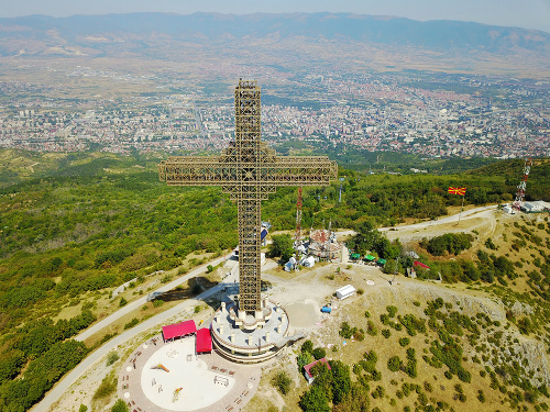 Aerial view of Great cross of steel structure against cityscape, Macedonia.