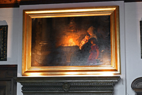 Na obraze je mníška s dvoma malými deťmi pri sviečke, ktoré deti zapálili svojim rodičom.