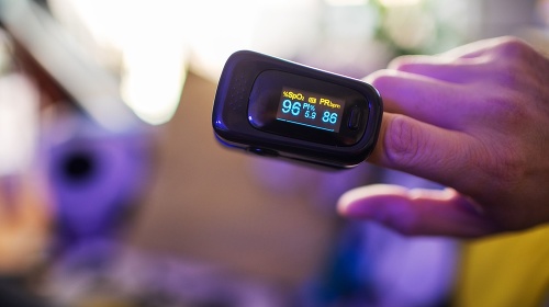 Oximeter for checking oxygen saturation in blood on male hand