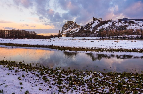 Snow Covered Devin Castle Ruins above the Danube River in Bratislava, Slovakia at Sunrise