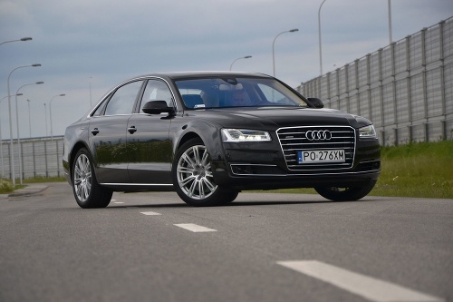 Warsaw, Poland - June, 21th, 2014: The new luxury limousine Audi A8 Lang stopped on the street during the test drive. The third generation of A8 model was revealed in 2010 but model after the facelifting was revealed in 2013. The A8 Lang has a lenght 526,5 cm and it is one of the most popular luxury limousines in Europe.