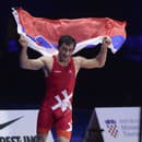 Slovenský zápasník Tajmuraz Salkazanov sa teší po víťazstve nad Talianom Frankom Chamizom Marguezom vo finále voľnoštýliarov v kategórii do 74 kg na majstrovstvách Európy v Záhrebe 19. apríla 2023. 