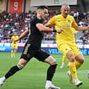 Na snímke zľava stredopoliar Spartaka Martin Bukata a stredopoliar Dnipra Vasyl Kravec v prvom zápase play off Európskej konferenčnej ligy (EKL) vo futbale FC Spartak Trnava - SC Dnipro-1 v Trnave v stredu 23. augusta 2023.