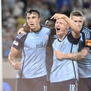 Na snímke zľava Dávid Strelec, Nino Marcelli a Juraj Kucka (všetci Slovan) oslavujú druhý gól.