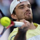 Český tenista Tomáš Macháč v zápase Australian Open proti Djokovičovi.