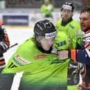 Na snímke zľava Brenden Miller (Žilina) a Michal Kabáč(Michalovce) počas šarvátky v dohrávke 38. kola hokejovej Tipos extraligy HK Dukla Ingema Michalovce - DOXXbet Vlci Žilina 22. januára 2025 v Michalovciach.