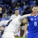 Na snímke zľava slovenský futbalista Robert Boženík a slovinský futbalista Sandi Lovrič bojujú o loptu v prvom zápase play off o postup do B-divízie Ligy národov Slovensko - Slovinsko.