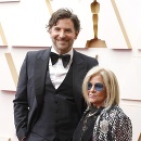 BRADLEY COOPER AND GLORIA CAMPANO during red carpet arrivals for the 94th Academy Awards