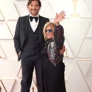 BRADLEY COOPER AND GLORIA CAMPANO during red carpet arrivals for the 94th Academy Awards