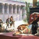 Obraz od britského maliara Lawrence Alma-Tadema - Kleopatra testuje jedy na odsúdencoch.