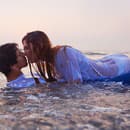erotic couple kissing in the water