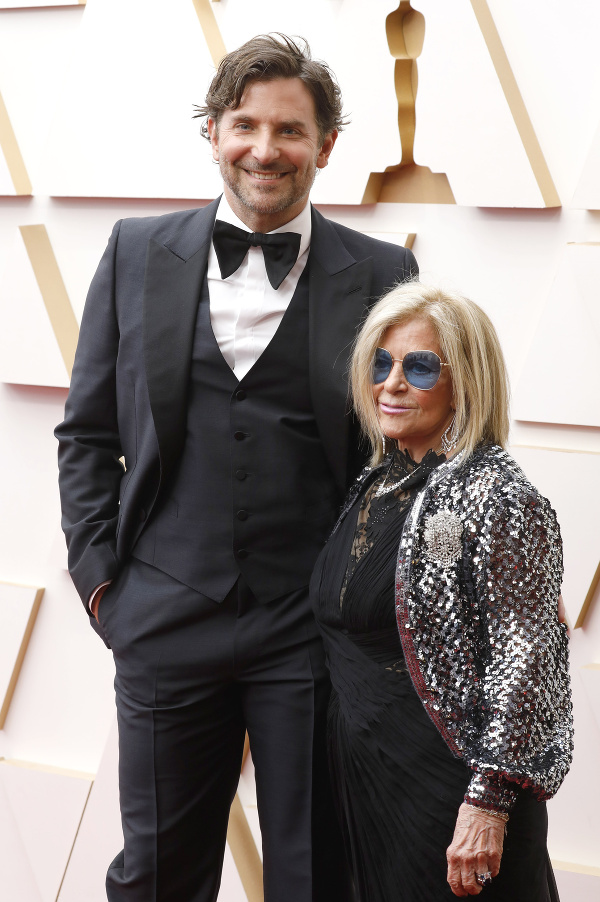 BRADLEY COOPER AND GLORIA CAMPANO during red carpet arrivals for the 94th Academy Awards